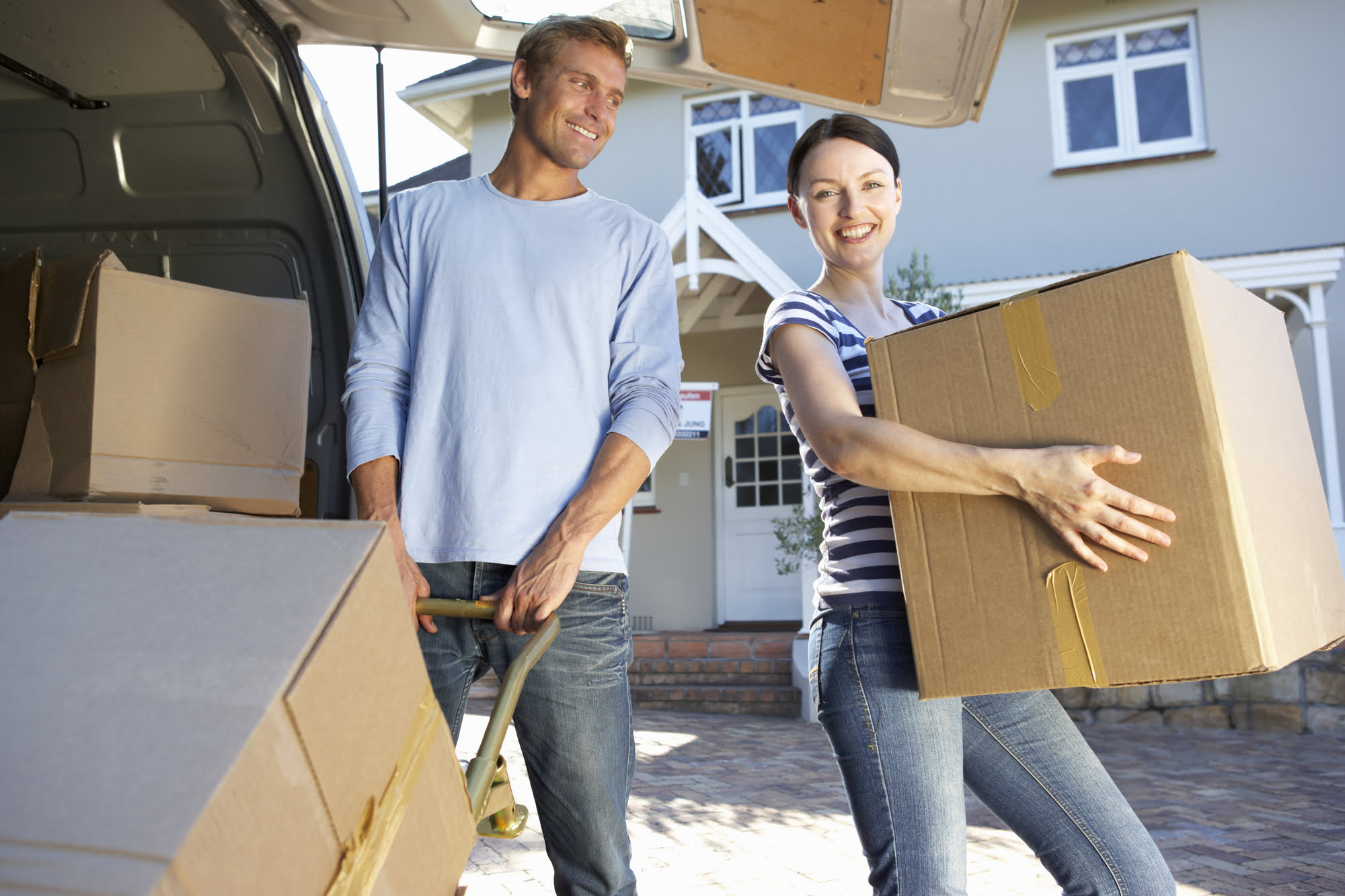 couple packing moving truck