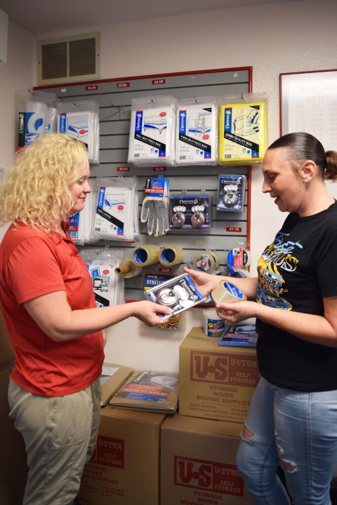 ustor manager, Natasha with a customer